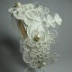 Headband with white embroidery application and pearls